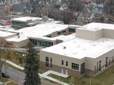 Large commercial building with a flat, white roof made possible with Duro-Last products